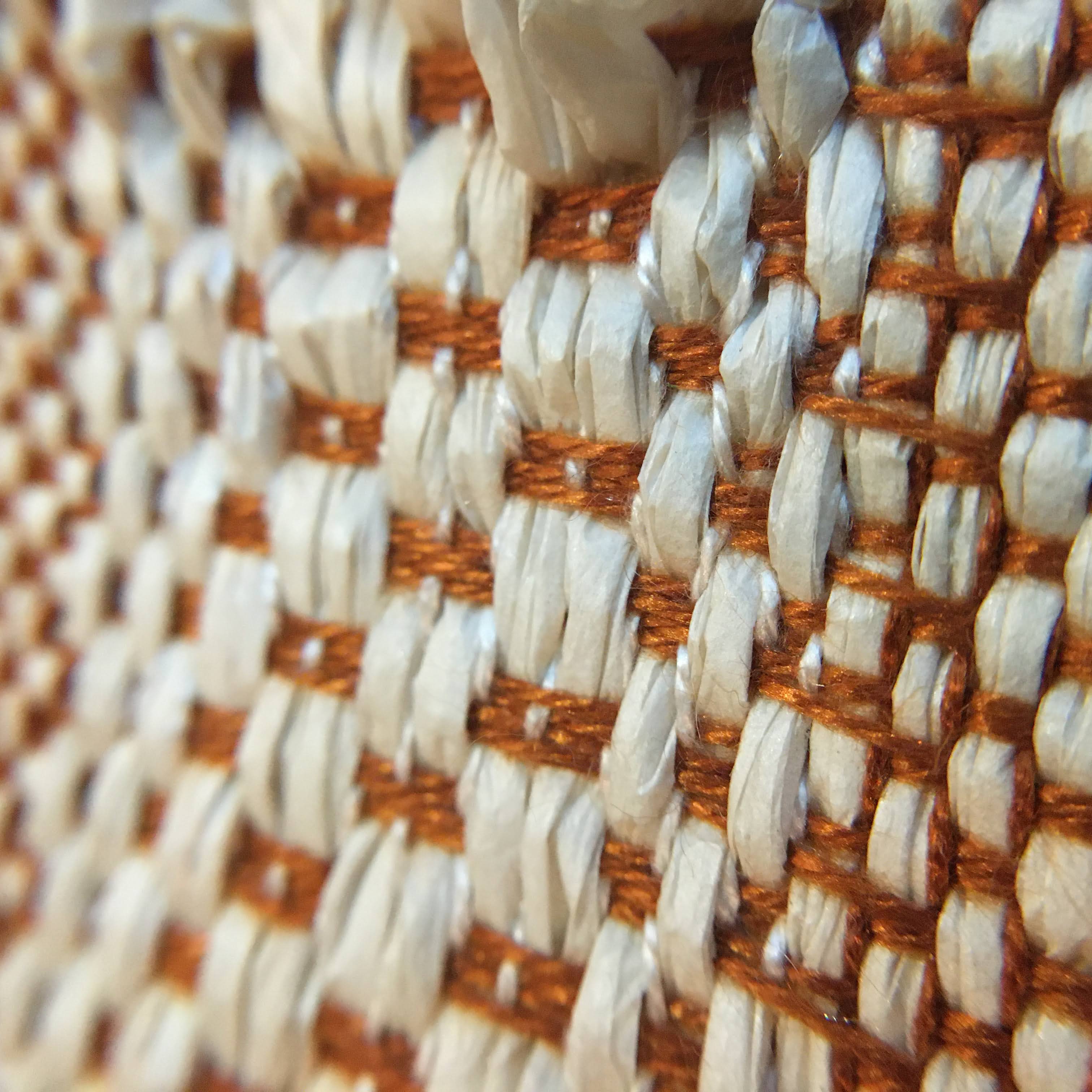 paper. yarn integrated into tencel warp. 